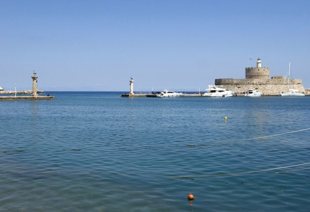 The entry of the old harbor of Rhodes (called Mandraki), from the embankment inside. Most accounts suggest that the gigantic statue stood here, photo credit