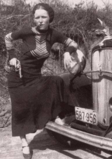 One of the most playful poses of Parker with a pistol and a cigar. The press branded her as a “cigar-smoking gun moll” by this photo.