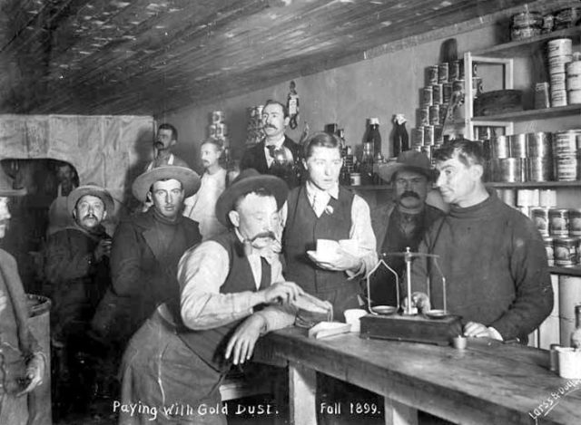Paying with gold dust in Dawson, 1899