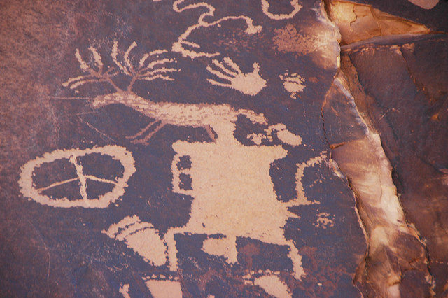 Figures were engraved by removal of the rock’s covering of what known to geologists as “desert varnish“. Photo Credit