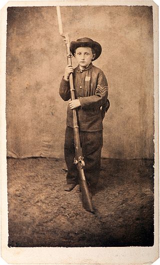 Carte of Sergeant John Clem armed with a rifle and bayonet.