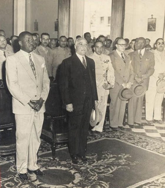 Trujillo with President Magloire of Haiti. Hector and Ramfis Trujillo in attendance