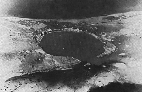 The crater created by detonation on May 5, 1958 (Operation Hardtack I, Cactus test). The site was later used to store nuclear waste.