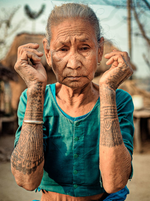 Studio waist up Portrait of an Old tattooed caucasian lady posing in  sleeveless tshit looking at the camera on black background Generative AI  Stock Illustration  Adobe Stock