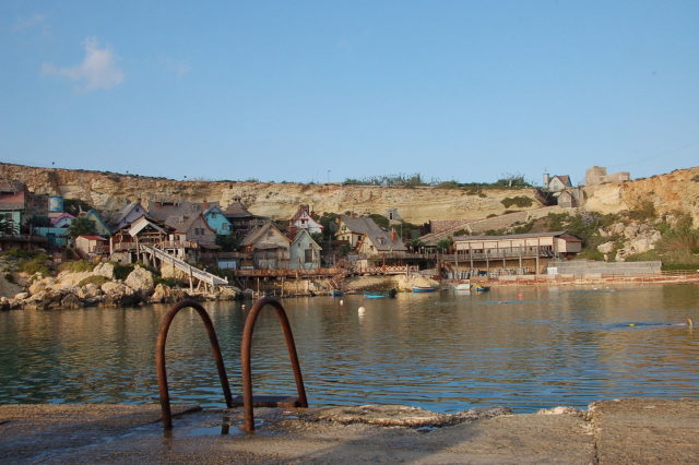 Popeye Village from pier in Anchor Bay Photo Credit