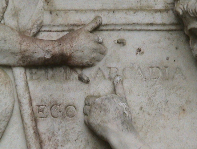 Fingers touching the letters ‘N’ and ‘R’ in the phrase ET IN ARCADIA EGO (“I am also in Arcadia”).