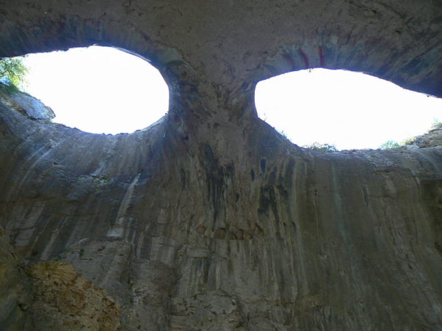 God’s eyes in Prohodna Cave, near village Karlukovo, Bulgaria. Central view