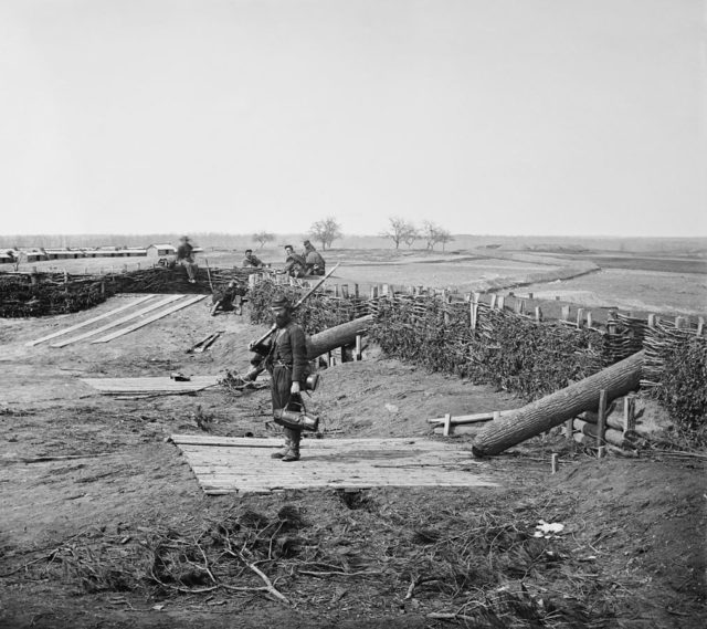 Quaker guns (logs used as ruses to imitate warfare cannons) in former Confederate fortifications at Manassas Junction March 1862. It is a commonly used deception tactic during the 18th and 19th centuries.