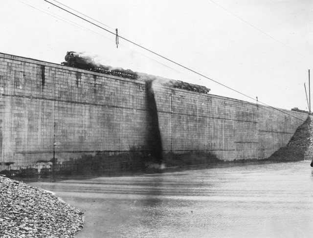 Earth is dumped into the reservoir on the upstream face of the Olive Bridge Dam. April 27,1914 Author New York Public Library