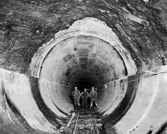 A section of the Rondout pressure tunnel with finished concrete lining in place. Author New York Public Library