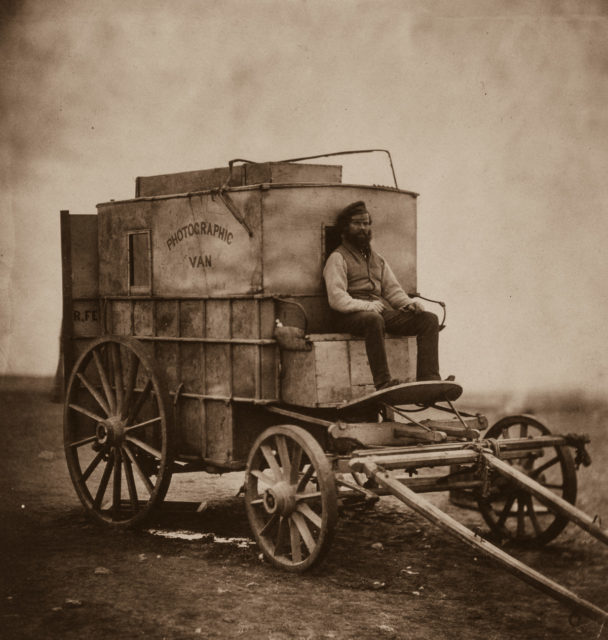 Roger Fenton’s portable darkroom and Marcus Sparling, his assistant. Sparling had requested this picture be taken as a last record before they ventured into a dangerous area.