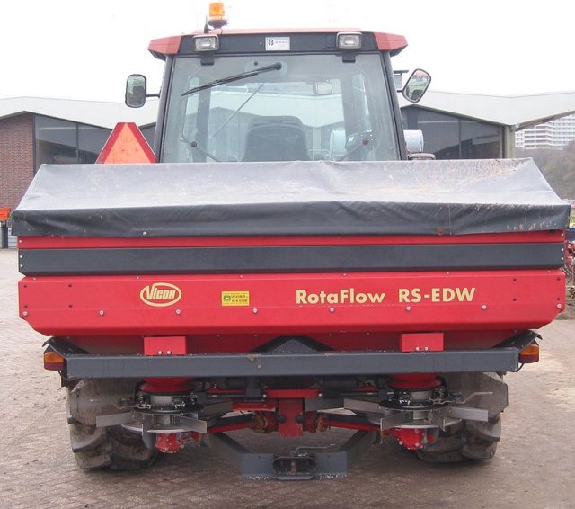 A large, modern fertilizer spreader Photo Credit