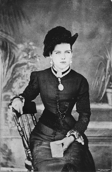 Woman seated in a chair at Cooktown, Queensland, 1880-1890