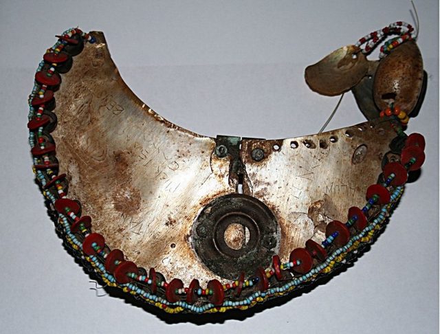 An example of a Kula necklace, with its distinctive red shell disc beads. Photo credit