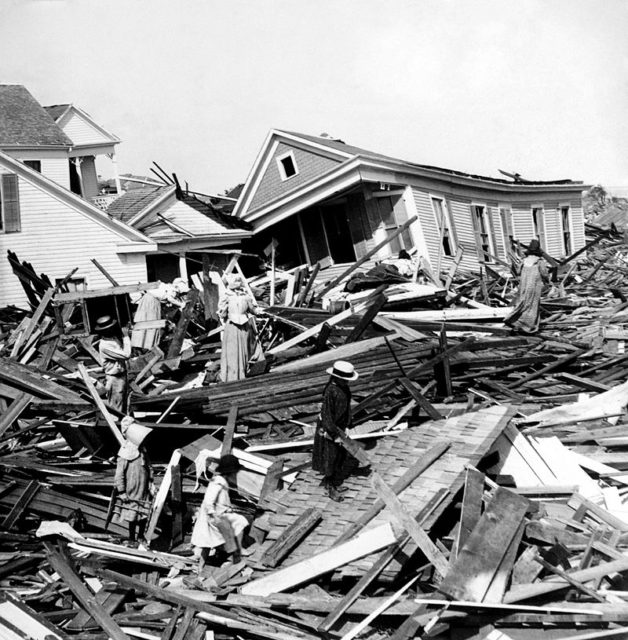 People rummage through the rubble of destroyed houses in Galveston several days after the hurricane.