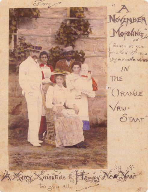 1892 Christmas card with a colored photo of the Tolkien family in Bloemfontein, sent to relatives in Birmingham, England.
