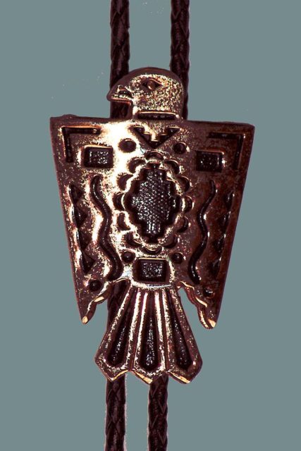 Bolo tie featuring Native American design.