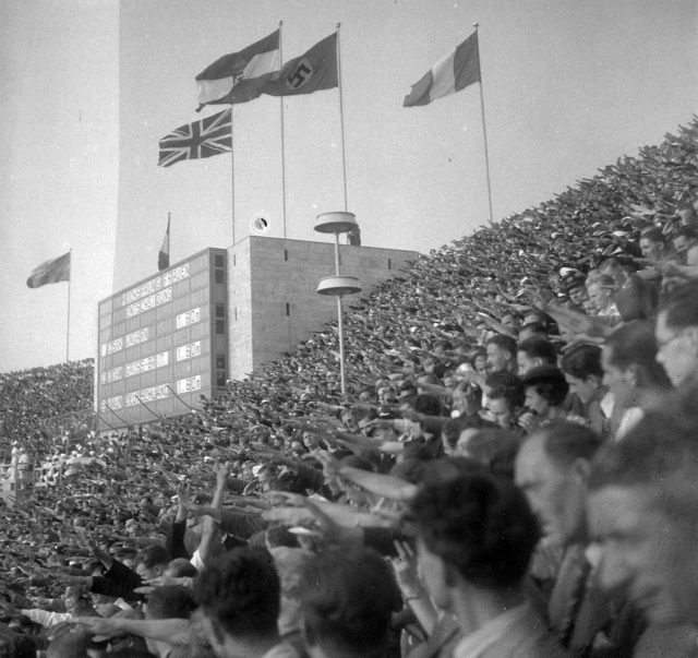 Spectators giving the Nazi salute during one of the medal ceremonies during the 1936 Olympic Games in Berlin. Photo by FORTEPAN / Lőrincze Judit, CC BY-SA 3.0.
