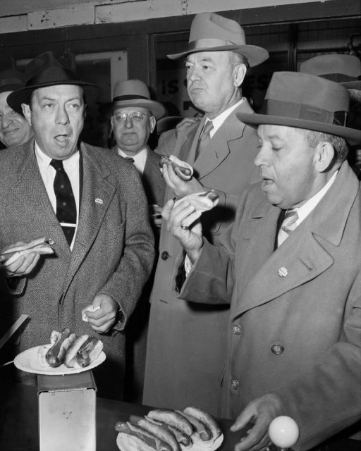 Mayor Robert Wagner, Borough President John Cashmore, and Nathan Handwerker of the Coney Island Chamber of Commerce gather at a hot dog stand before strolling on the boardwalk. Photo By: Cary Mamay/NY Daily News via Getty Images