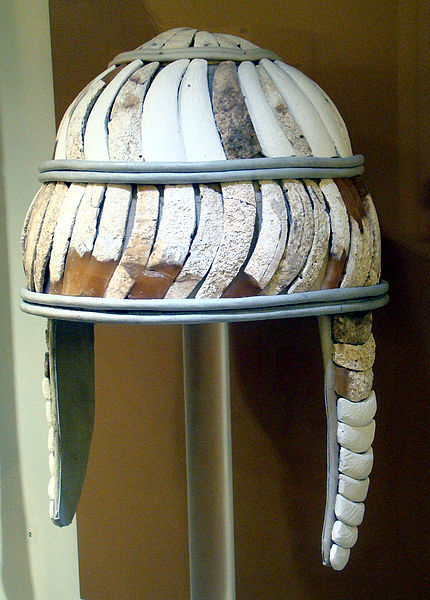A leather helmet covered with two rows of boar tusks from the tomb at Katsambas. Heraklion Archeological Museum. Scholars believe that they may have been worn by leaders as a status symbol or a means of identification. Author: O. Mustafin – Public Domain.