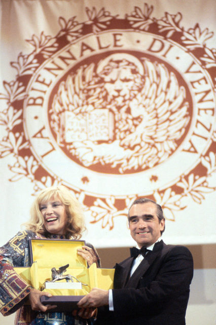 Scorsese receives Golden Lion for Lifetime Achievement from actress Monica Vitti at the Venice Film Festival in 1995. Author: Gorupdebesanez. CC BY-SA 3.0.