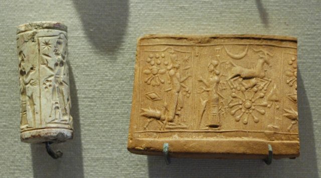 Mesopotamian cylinder seal made of limestone, depicting a scene where the God Shamash is worshiped.