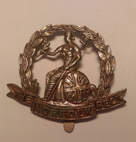 Photo of Royal Norfolk Regiment Cap Badge from personal collection. Author: Dormskirk. CC BY-SA 3.0