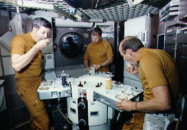 Skylab 2 crew eats food during ground training