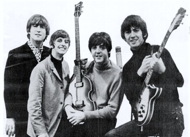 The Beatles in 1965, celebrating a Grammy win