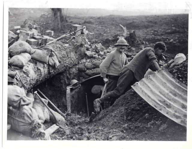 Soldiers build a new dug-out as they advance.