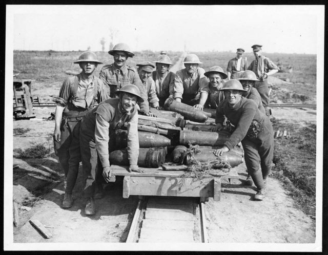 Royal Garrison Artillery gunners pushing a light railway truck filled with shells, behind Zillebeke,  October 1917.