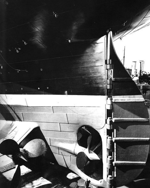 According to the source, United States Library of Congress, this is an image of Titanic’s stern and rudder. Others claim it to be of her sister Olympic. Note the man at the bottom of the photo