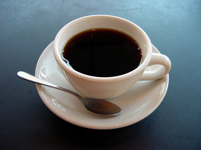 A cup of coffee on a blue table