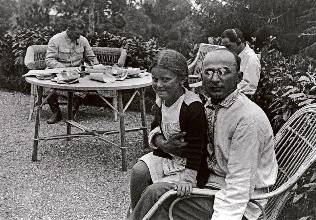 A young Svetlana sitting on Lavrentiy Beria’s lap with Stalin (in background) and Nestor Lakoba