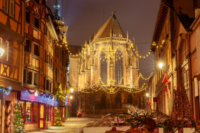 Traditional old half-timbered houses in the historic city of Colmar. Decorated and lighted during the Christmas season. Alsace. France.