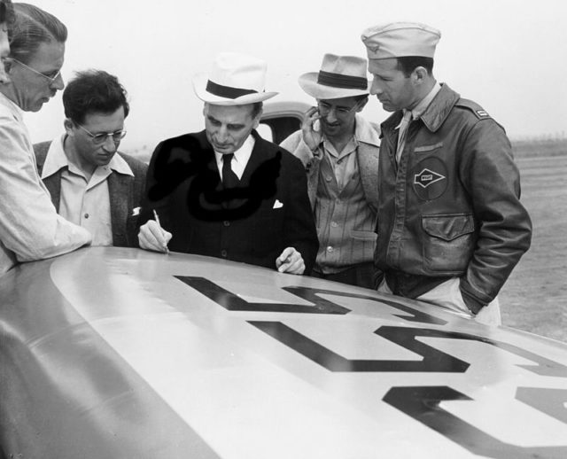 The GALCIT JATO engineering team during the solid propellant tests in January 1940. Parsons is visible cropped out on the extreme left alongside Clark Blanchard Millikan, Martin Summerfield, Theodore von Kármán, Frank Malina and pilot, Captain Homer Boushey.