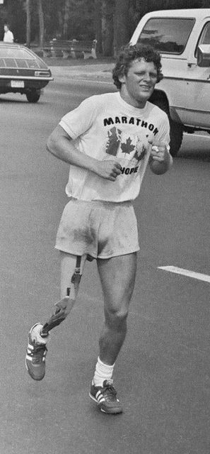 The sight of a young man with short, curly hair and an artificial right leg running down the street became famous. His T-shirt reads “Marathon of Hope”