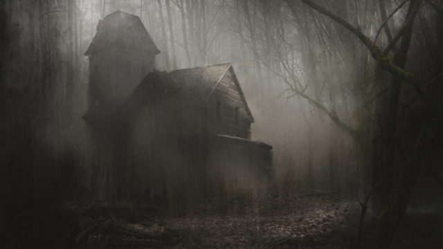 A haunted house in the middle of a creepy dark forest