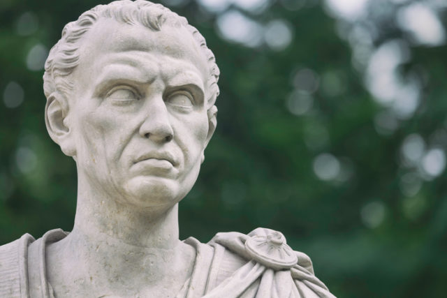 A sculpture of the Roman emperor Julius Caesar near the old orangery in the public Lazienki Park, Warsaw. The sculpture was made by Franciszek Pinck (1733-1798).