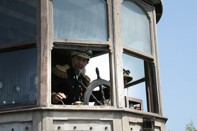 Major Catastrophe (AKA Shannon O’Hare ) at the helm of Neverwas Haul. Photo by nicolas will CC BY-SA 2.0