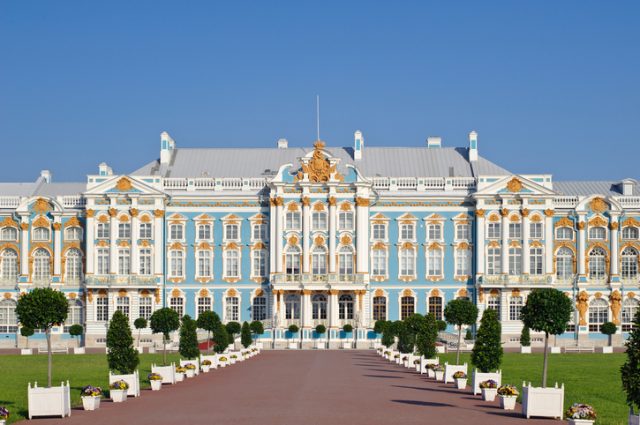 Main facade of the historic palace, Baroque style. Blue, white and gold gamma. Summer sunny day.