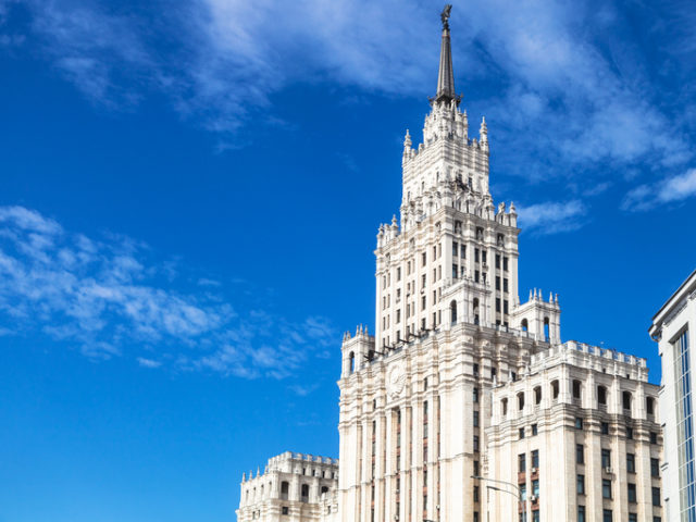 view of old Stalin’s skyscraper Red Gates Administrative Building in Moscow city under blue sky in sunny autumn day