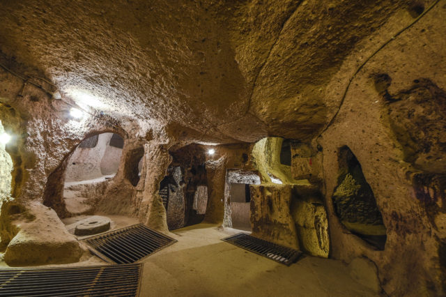 The Derinkuyu underground city is an ancient multi-level cave city in Cappadocia, Turkey. Stone used as a door in the old underground city