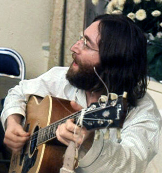 John Lennon singing Give Peace a Chance. Photo by Roy Kerwood CC BY 2.5