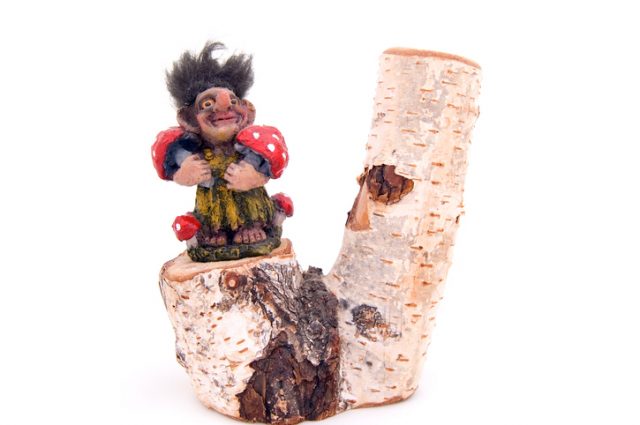 Troll on a birch log