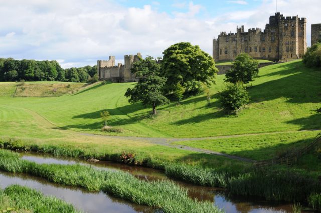 Alnwick Castle overlooks the River Aln in Northumberland, England. There has been a castle on this site since 1096