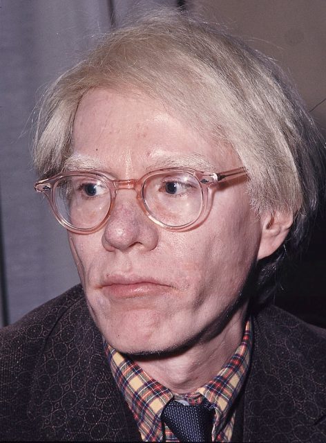 Portrait of the American artist Andy Warhol at his exhibition dedicated to Black transvestites in the US. Ferrara, November 1975.