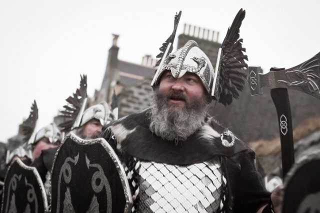 Shetland Isles, North of Scotland, UK – January, 28th 2014: Up Helly Aa 2014 vikings photographed marching through the streets of Lerwick in the Shetland Isles. As the thousands of spectators look on in admiration of the attire they have spent the last 12 months crafting by hand.