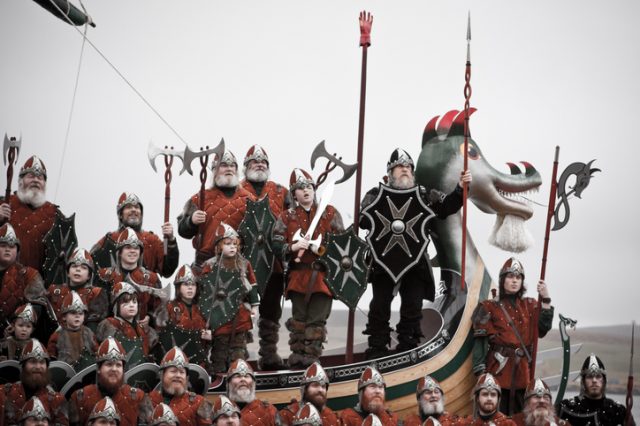 Shetland Isles, Scotland, UK – January 27, 2015: The Jarl Squad photographed during the official photograph on and in front of the galley ship on Up Helly Aa day in Lerwick in the Shetland Isles 2015