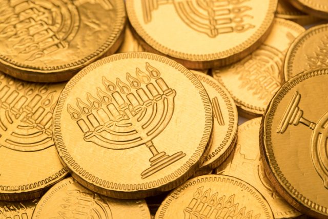 A stock photo of a Hanukkah Gelt Chocolate Coin. Photographed using the Canon EOS 1DX Mark II. Perfect for designs or articles about Hanukkah, Chanukah, jewish or the Holiday Season.